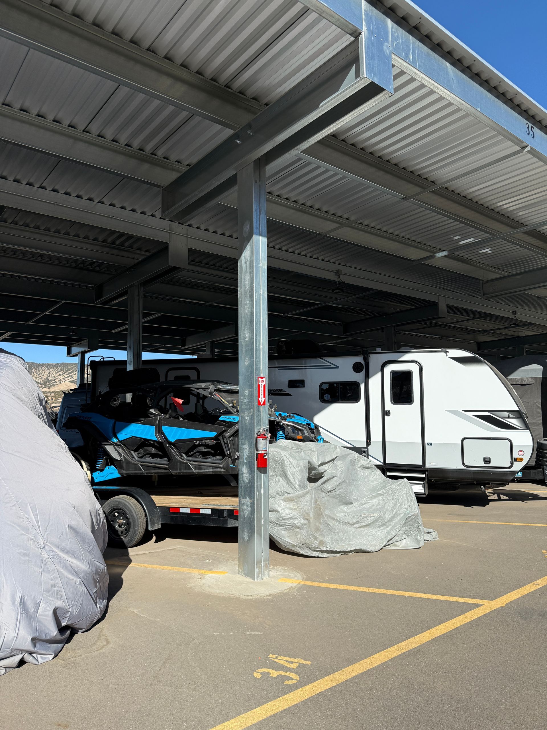 Covered RV and jet ski storage space at Eagle Canopy RV Storage