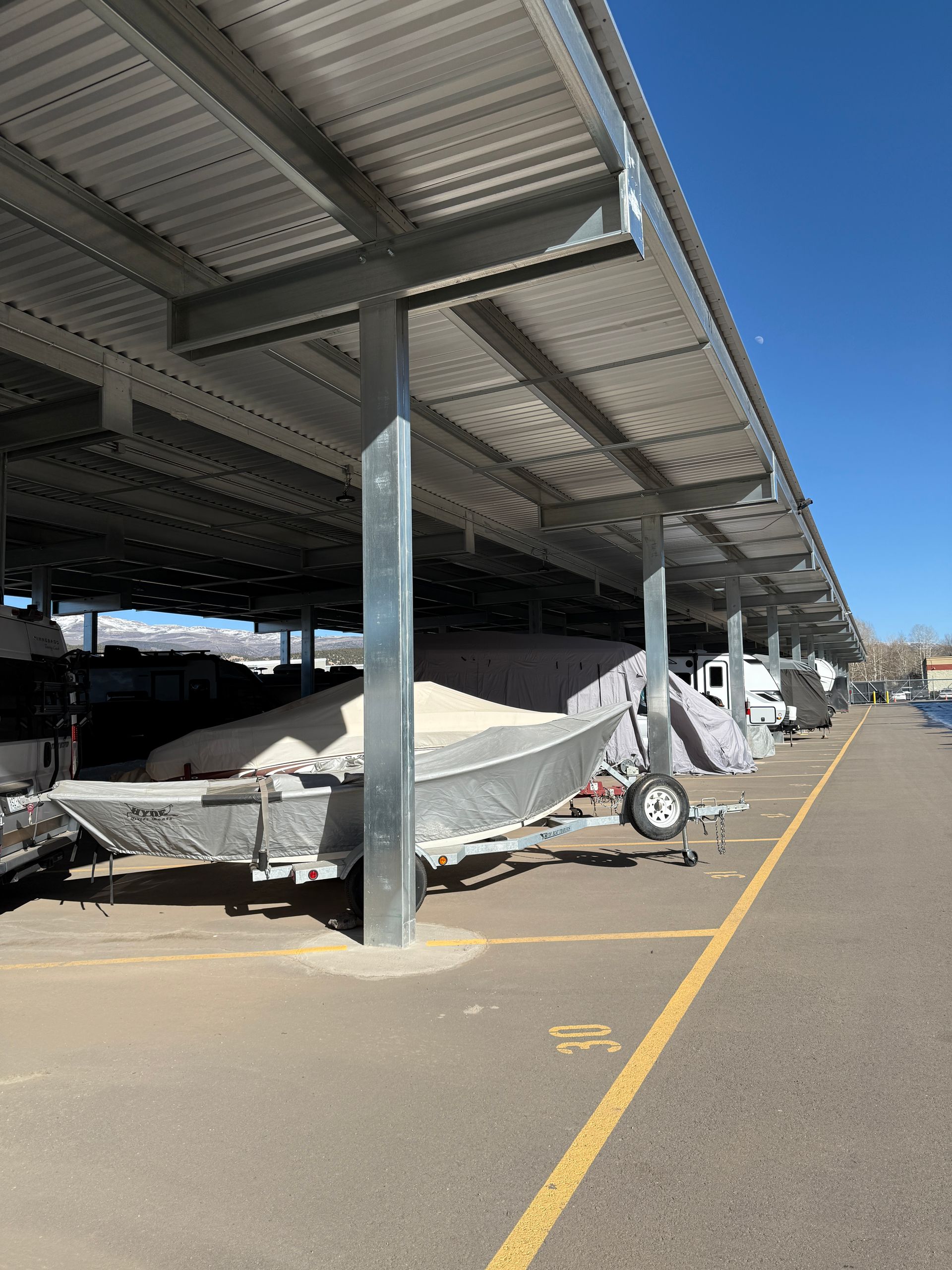 Covered boat storage with paved access at Eagle Canopy RV Storage