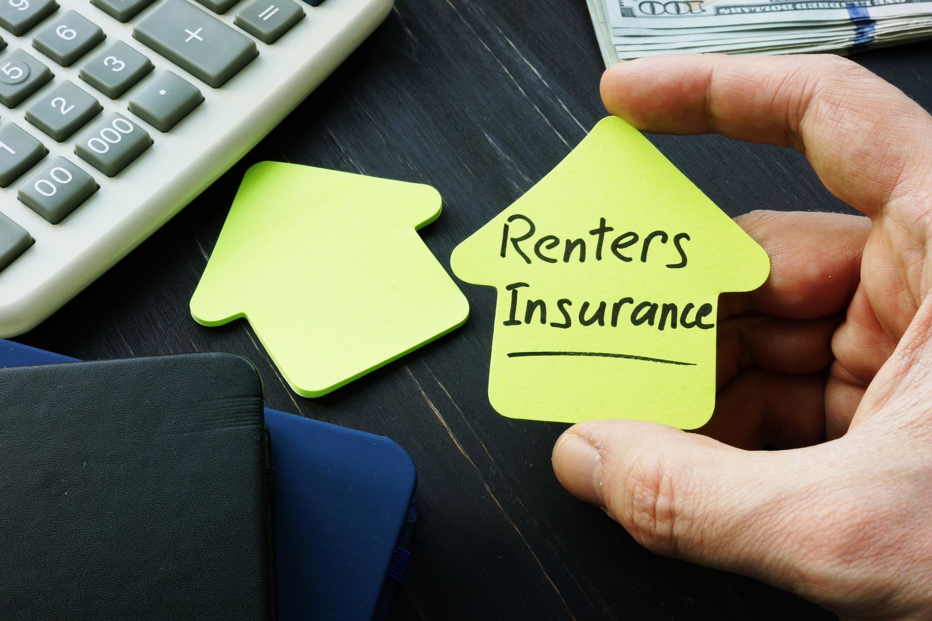 Nick Hall Agency LLC renters insurance plan in Fremont, NE displayed on house-shaped sign