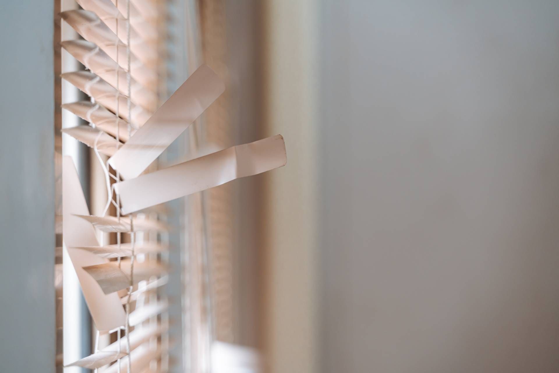 Window blinds that require repair and maintenance to restore the bent slats to their former glory