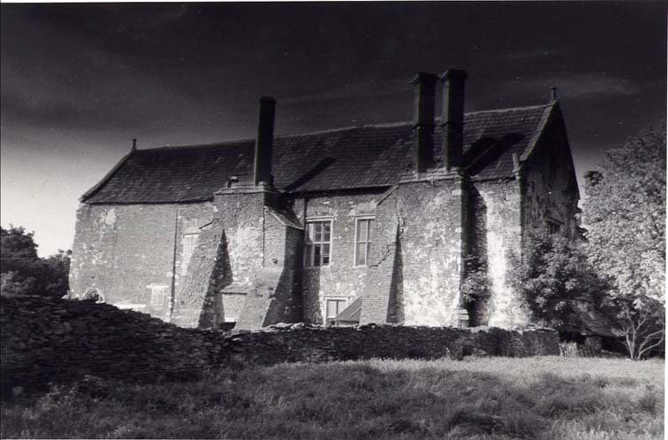 A black and white photo of Acton Court