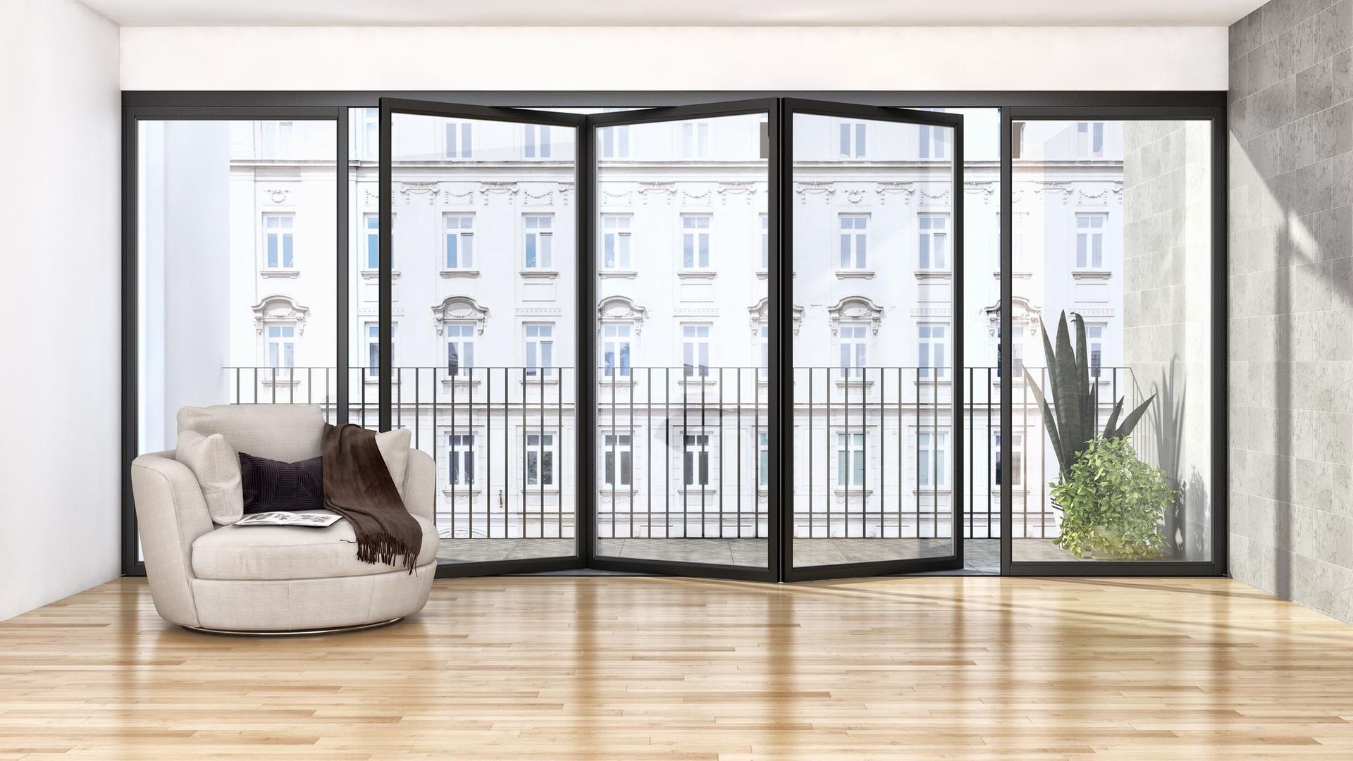 Bright empty living room with large floor-to-ceiling windows, light wood floors, and a beige armchair.