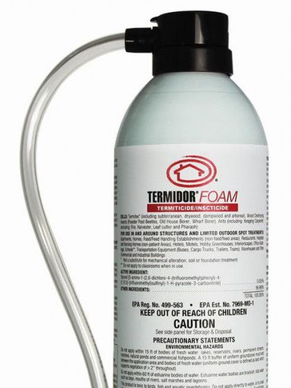 A bottle of termidor foam with a hose attached to it