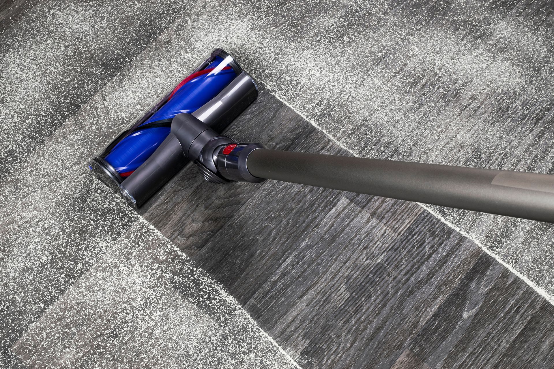 A Vacuum Cleaner Is Cleaning a Carpet with A Brush