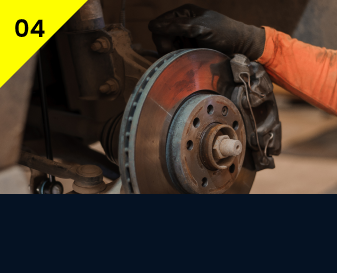 A person is working on a brake disc on a car. | Wagamon Brothers