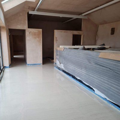 man in blue overalls and a hard hat