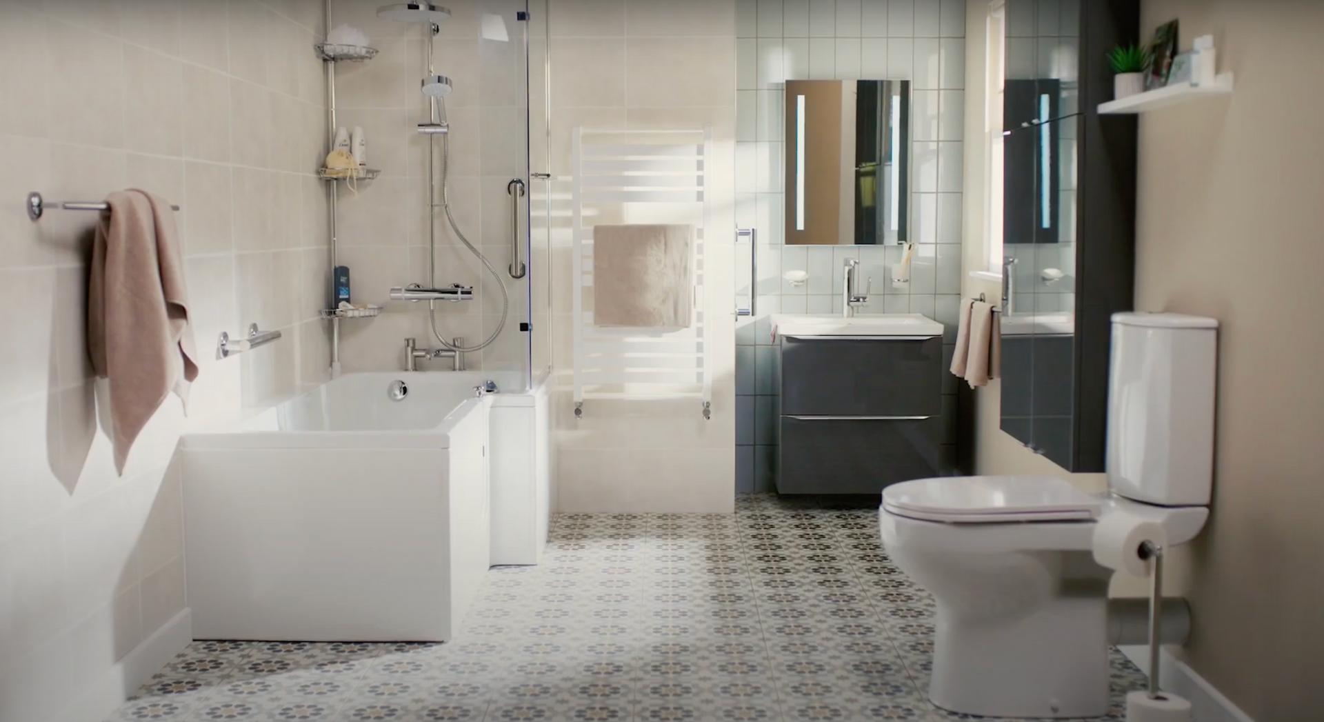 A large white bathroom with patterned tiles, clean modern furnishings, and an accessible tub with handles and a walk-in tub.