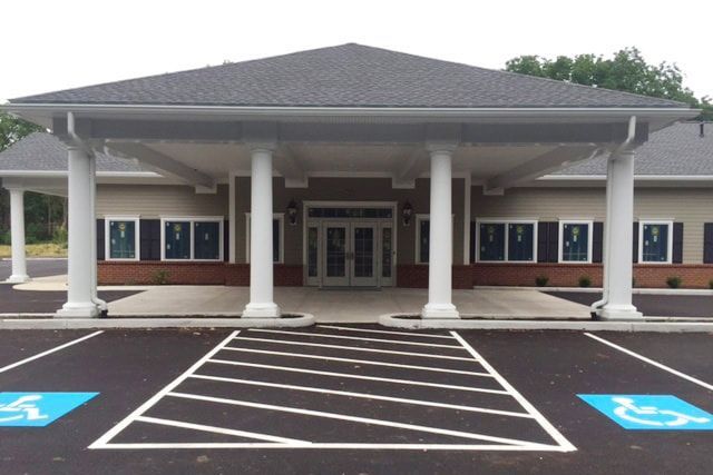 a building with a handicapped parking spot in front of it