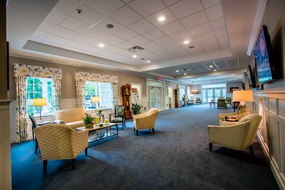 a large living room filled with furniture and a television .