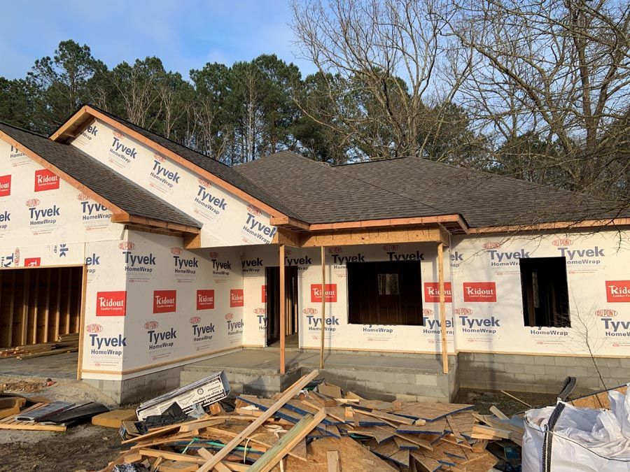 A house is being built in the middle of a forest.