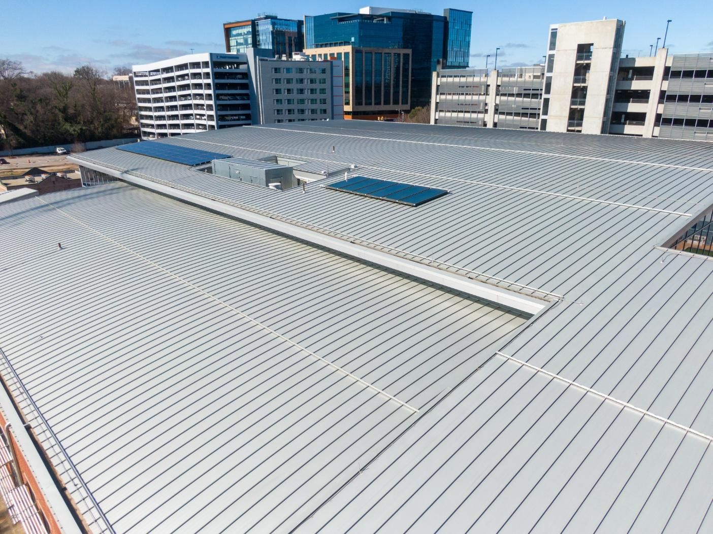 An aerial view of a house with a new roof.