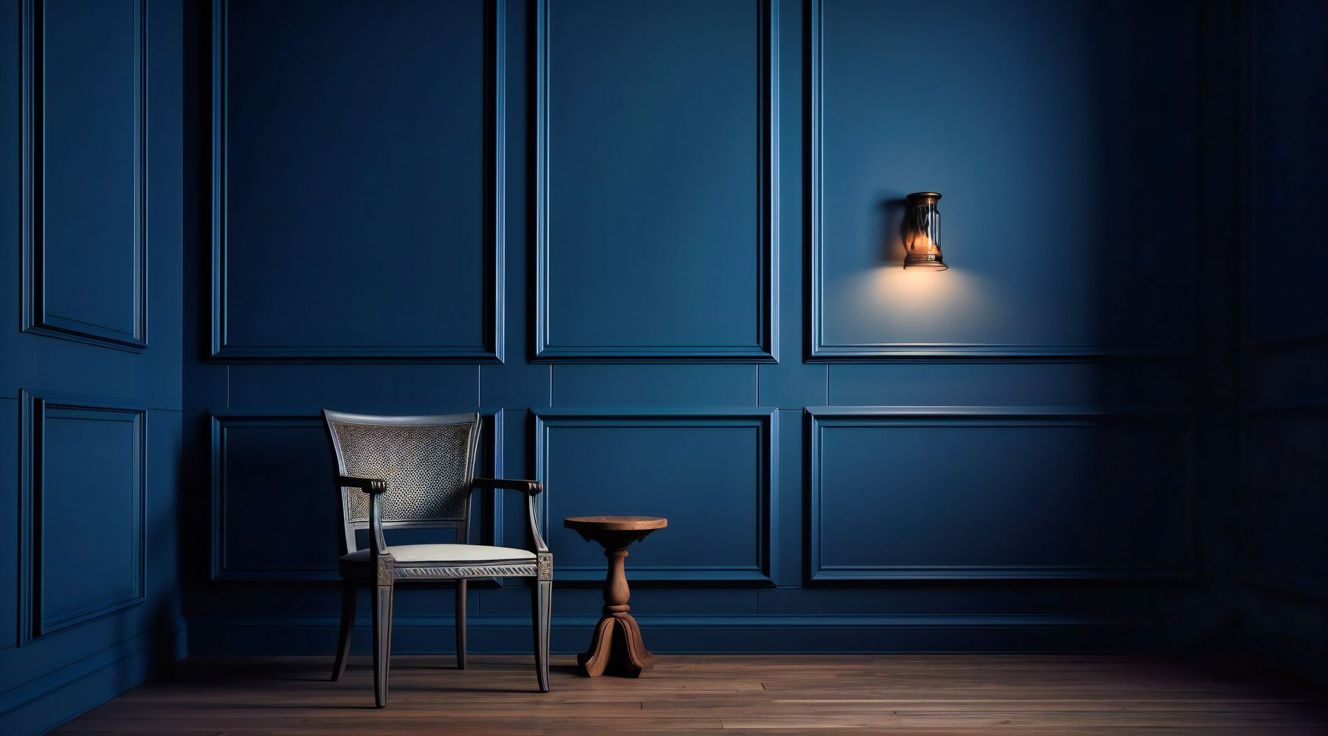 a chair and a table in a dark room with blue walls .