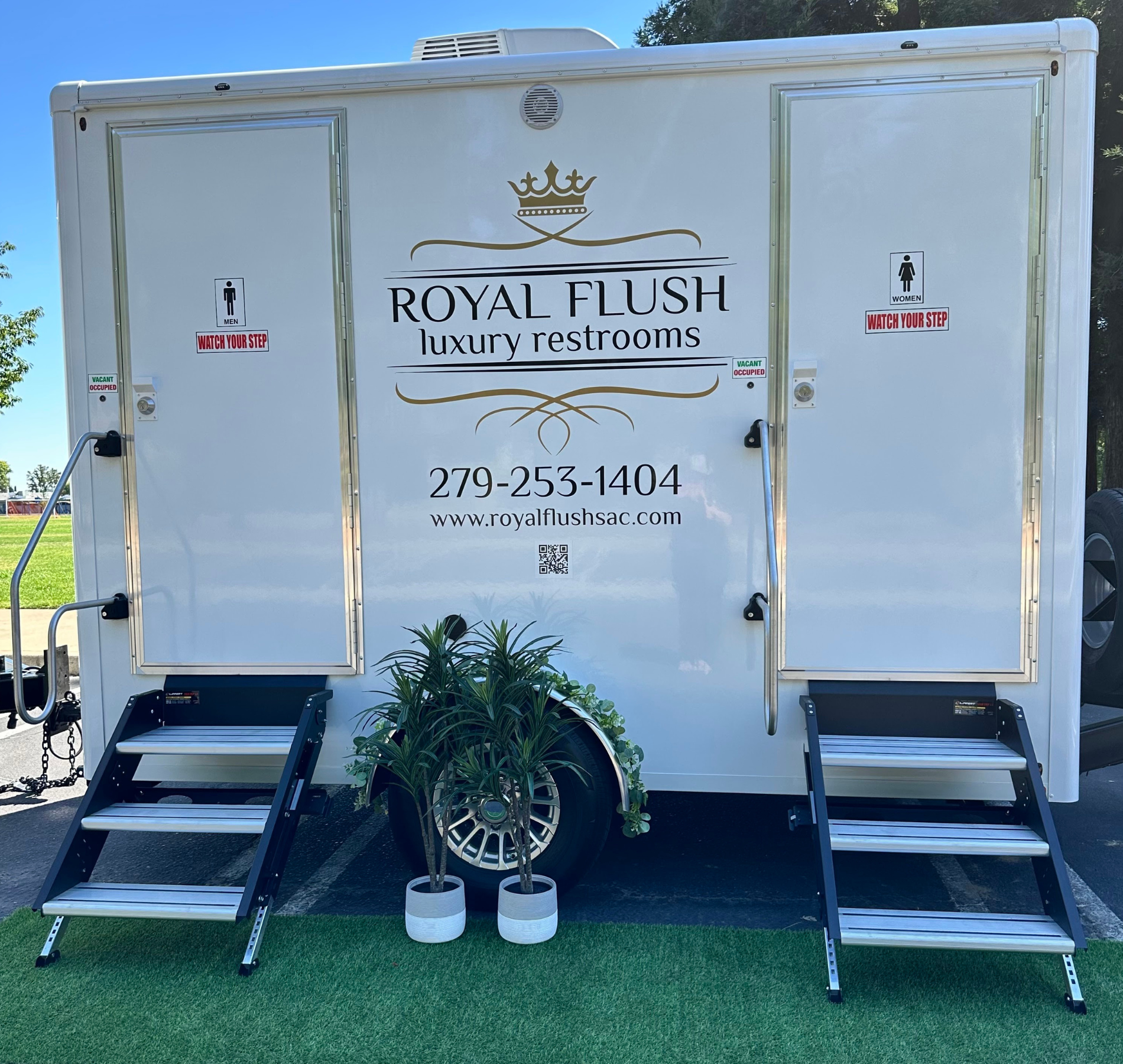 White Royal Flush luxury restroom trailer with two doors and steps.
