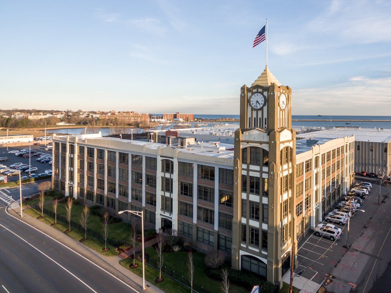 An aerial view of a large building with a clock tower.