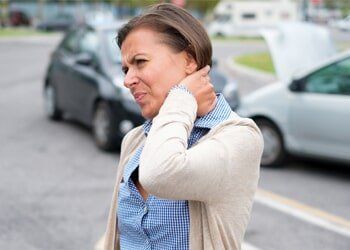 Personal Injury Attorney — Woman Neck Hurting in Miamisburg, OH