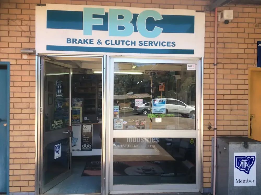 A Brick Building With A Sign That Says FBC Brake & Clutch Services — Figtree Brake & Clutch Services in Figtree, NSW