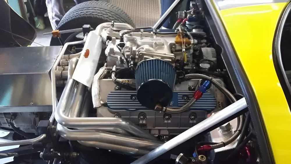 Engine Of A Yellow Car — Figtree Brake & Clutch Services in Balgownie, NSW