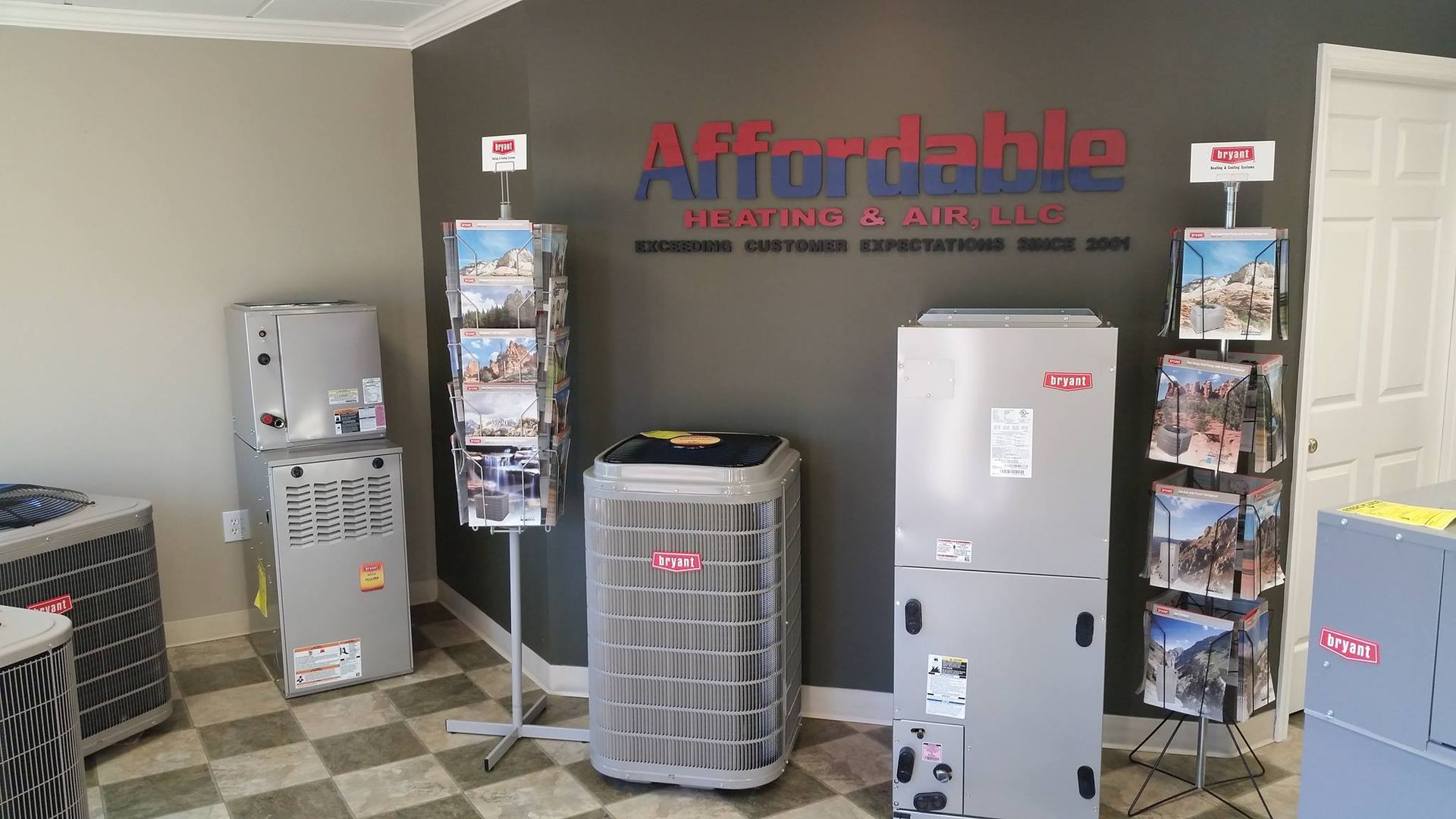 A room filled with a variety of air conditioners and heaters.