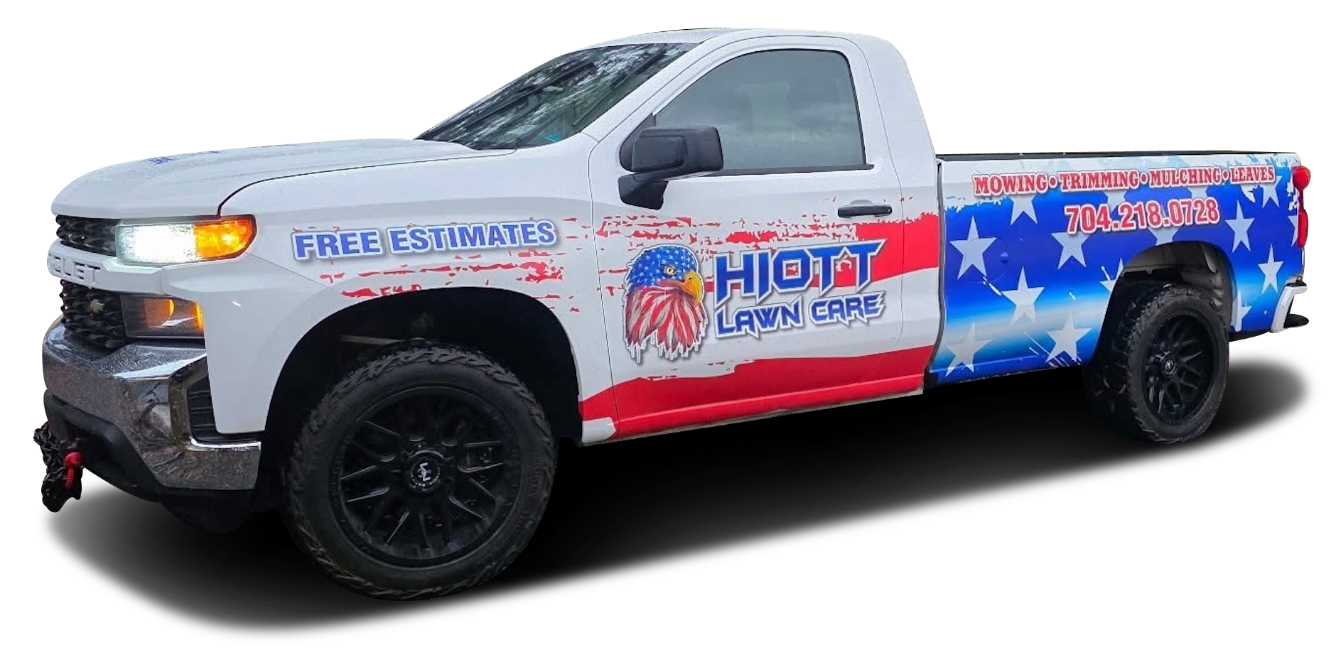 White truck with an American flag design advertising 