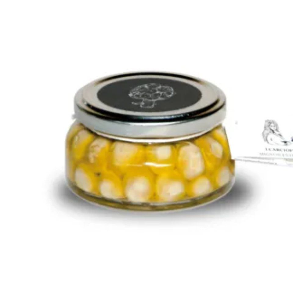 Un barattolo di peperoni gialli con un coperchio nero