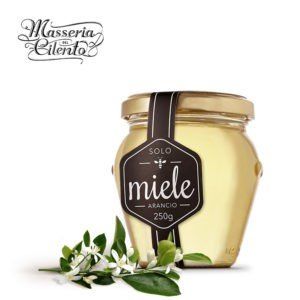 Un barattolo di miele con un'etichetta che dice miele