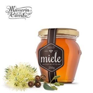 Un barattolo di miele con un'etichetta che dice miele