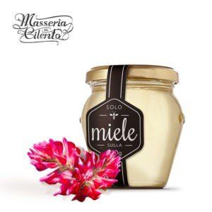 Un barattolo di miele con un'etichetta che dice miele