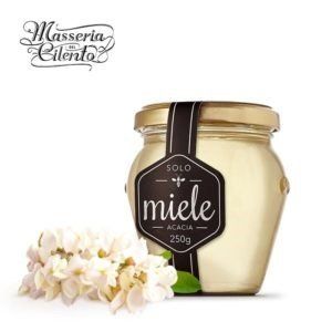 Un barattolo di miele con un'etichetta che dice miele