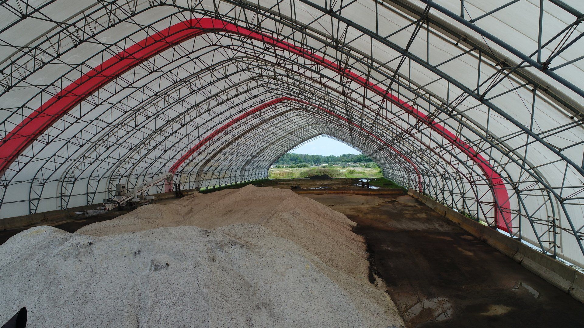 A large building with a lot of dirt inside of it.