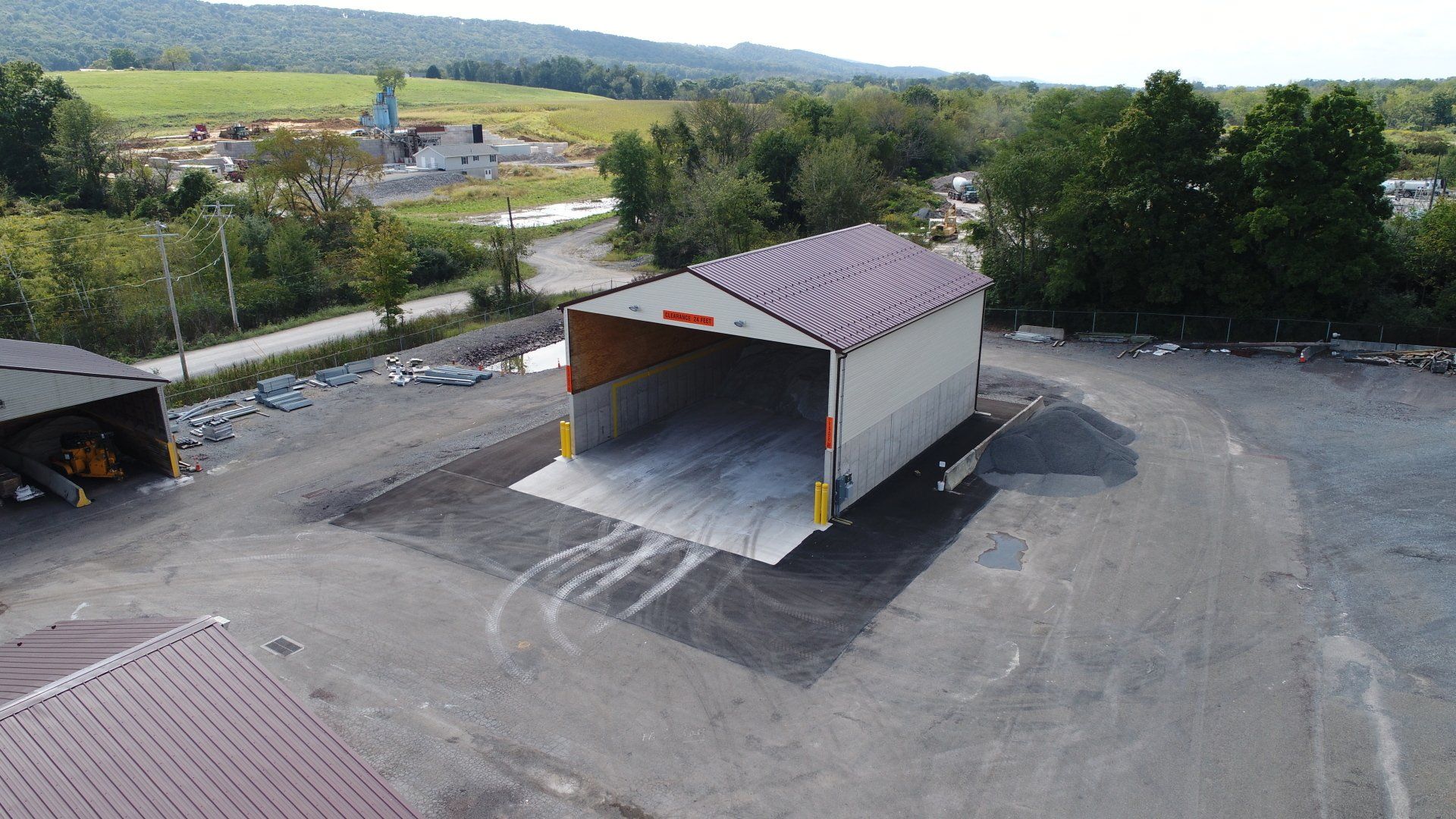 An aerial view of a large building in a parking lot.