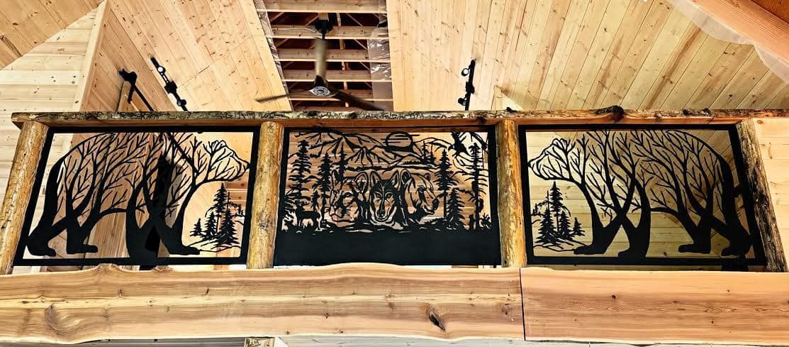 Three metal forest scenes framed above a wooden beam. Bears and trees are the focus.