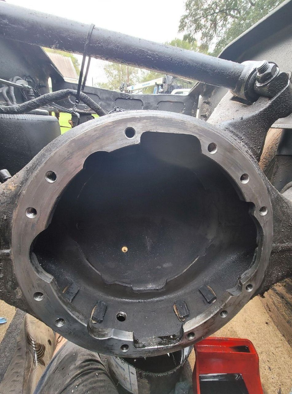 A close up of a rear differential cover on a truck.