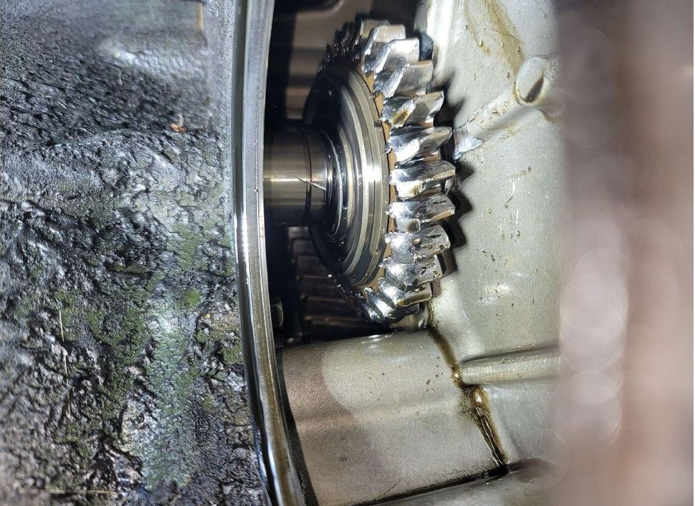 A close up of a gear in a car engine.