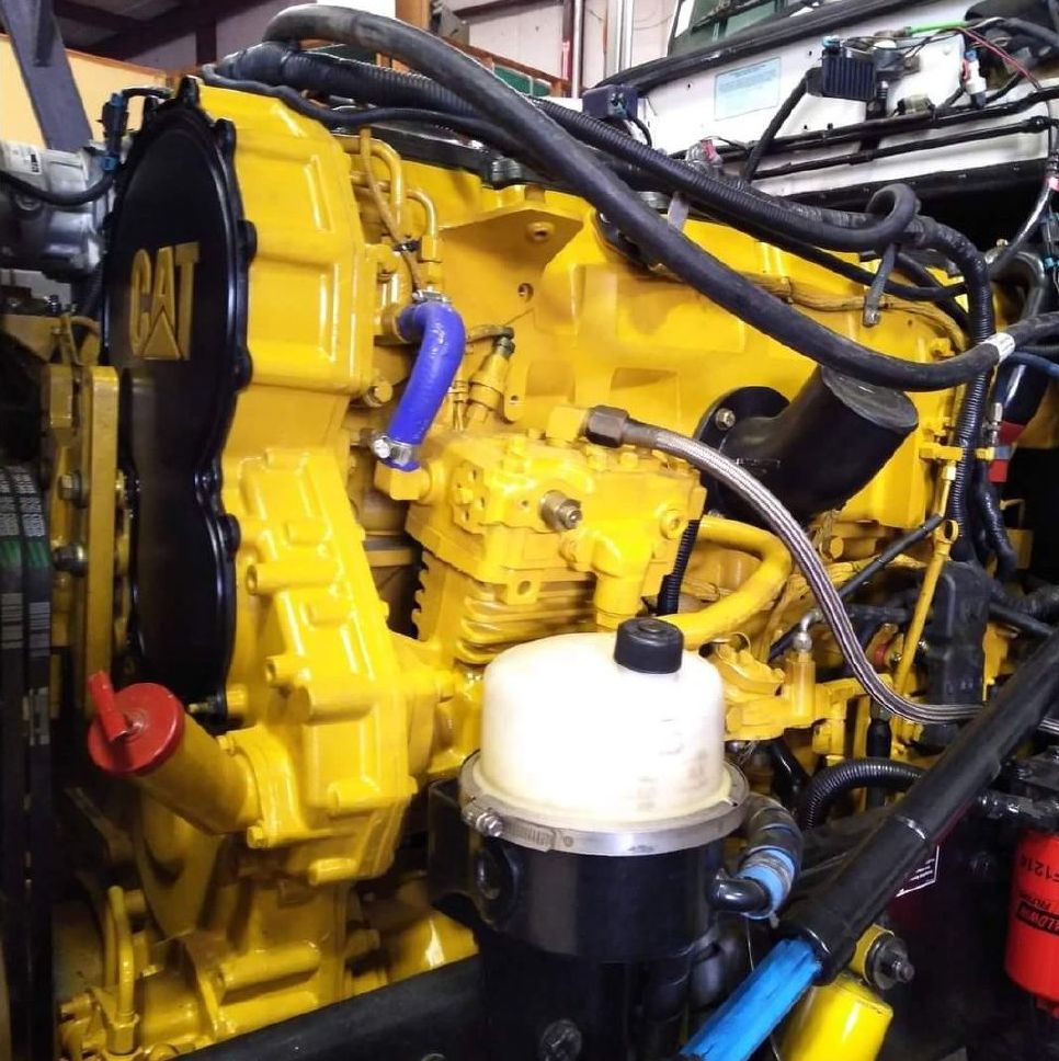 A yellow engine with the word cat on it