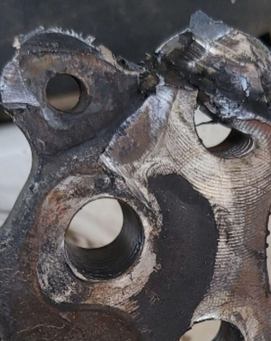 A close up of a piece of metal with holes in it