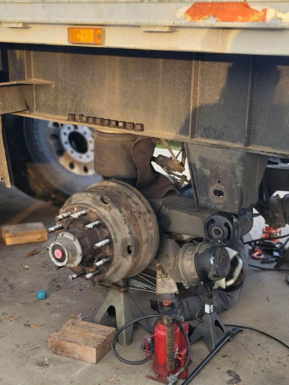 A truck is being worked on in a garage