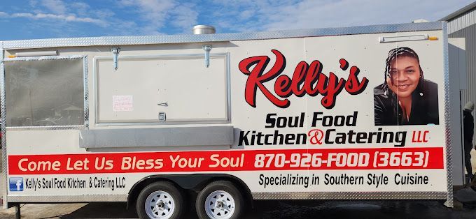 A white trailer with kelly 's soul food kitchen and catering written on it