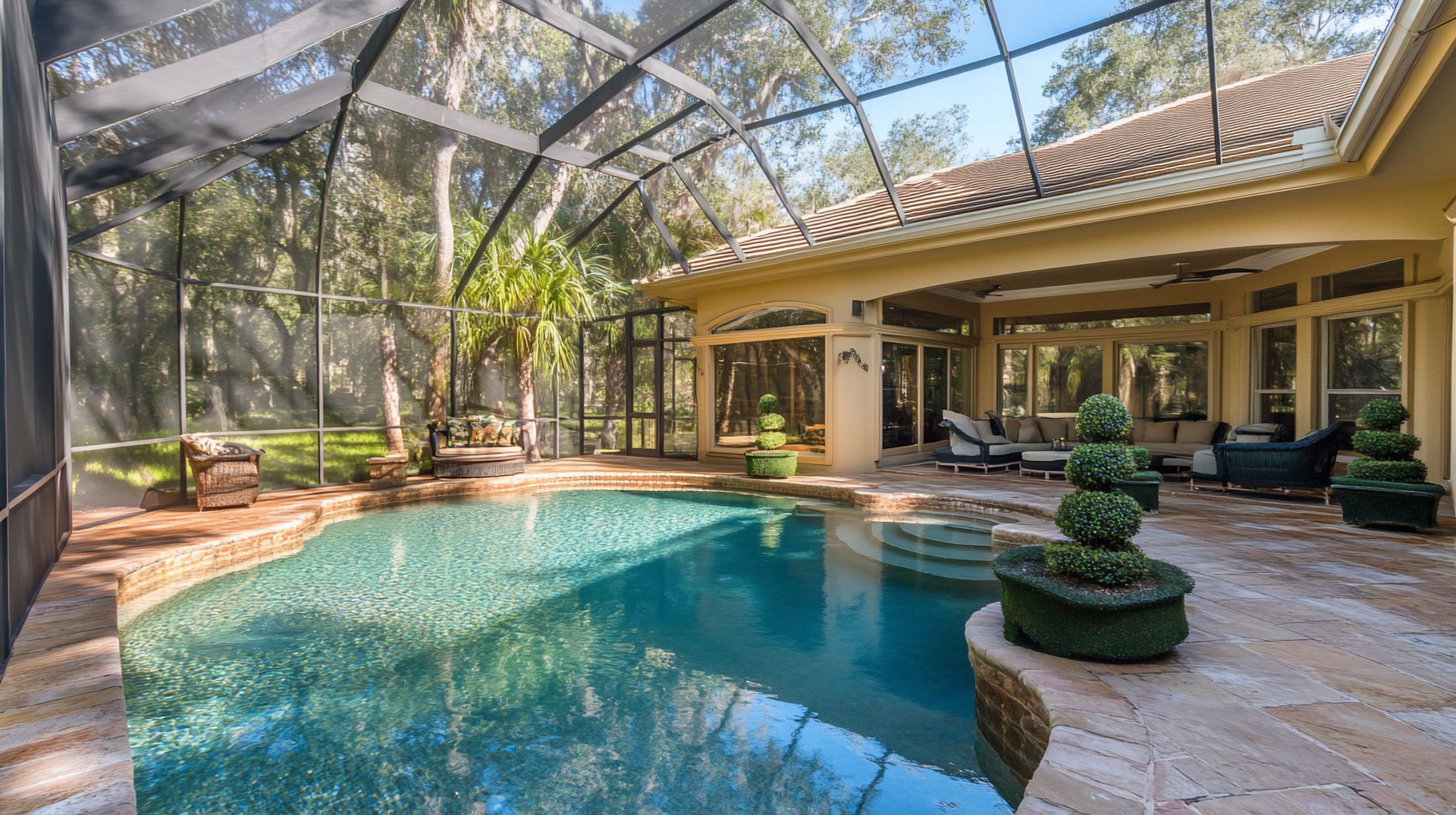 Screened patio enclosure surrounding luxury pool area with outdoor living space and views. Screened patio enclosure surrounding luxury pool area with outdoor living space and views.
