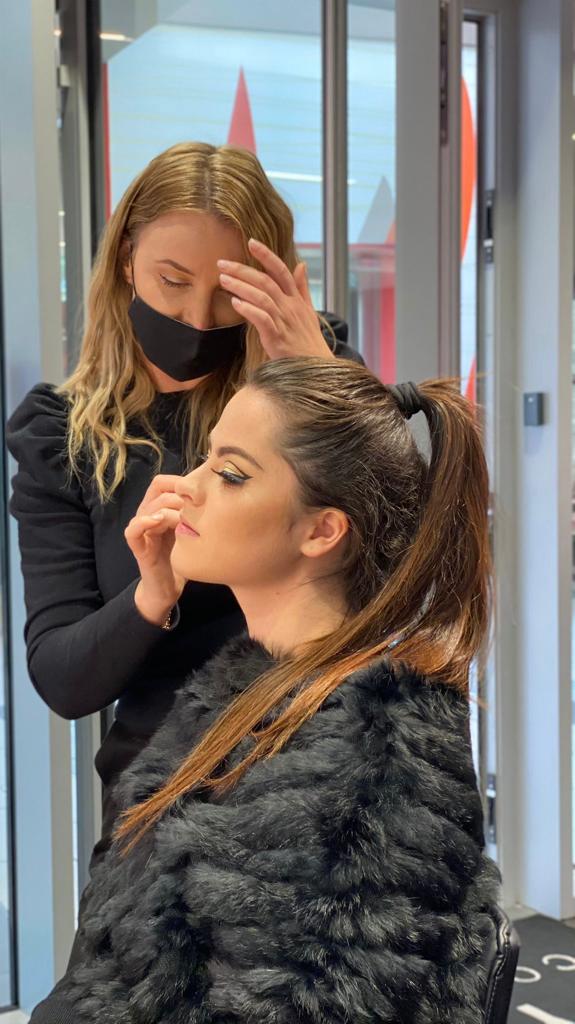 Make-up artist applying make-up to a client