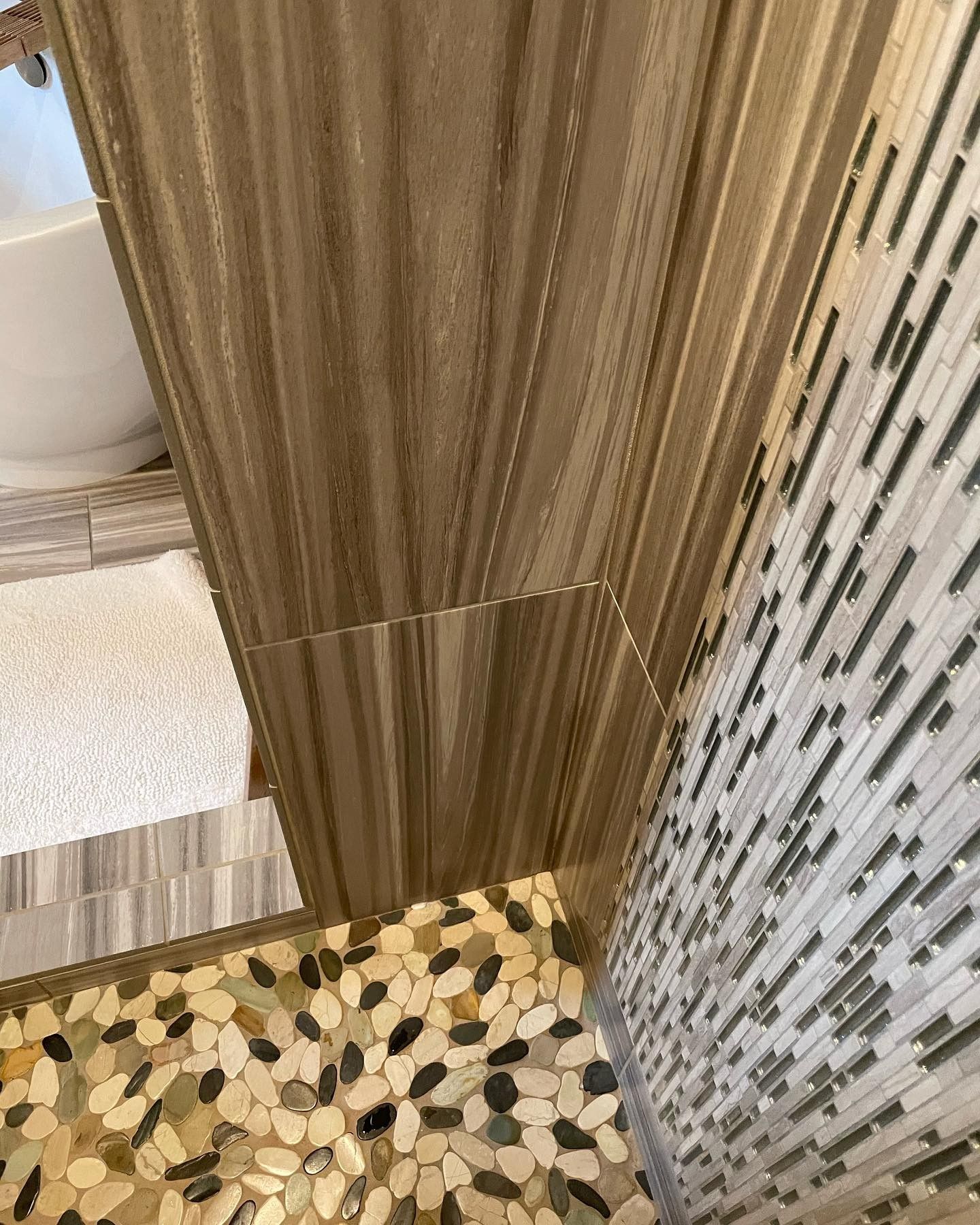 A bathroom with a walk in shower and a bathtub.