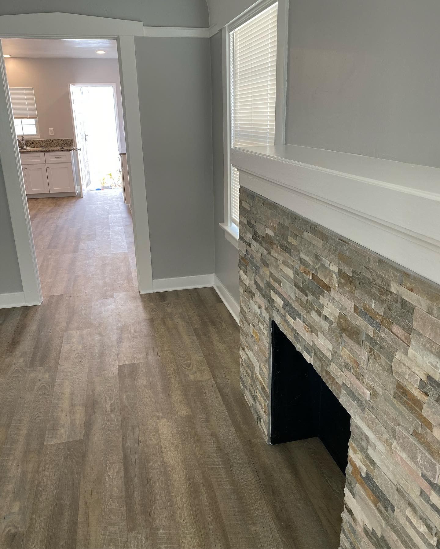 There is a fireplace in the middle of the room.