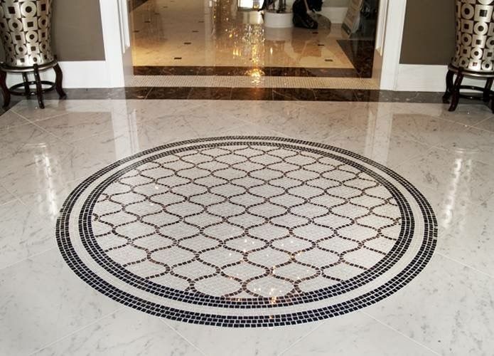 A marble floor with a circular design in the middle