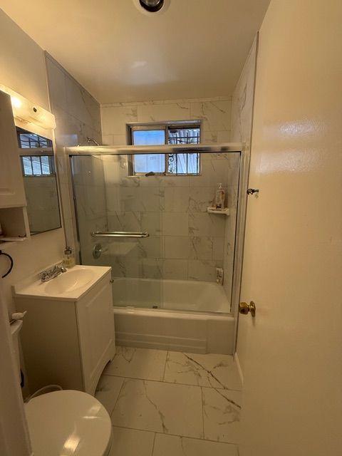 A close up of a tile floor with a geometric pattern
