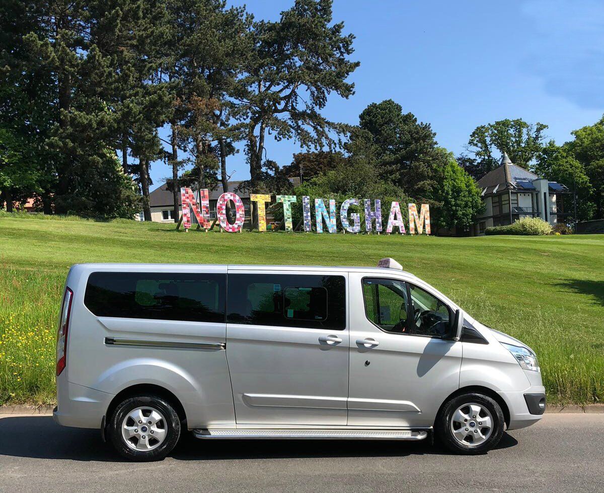 silver minibus in Nottingham signage