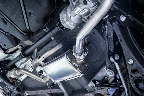 A close up of the underside of a car with a exhaust pipe. | Lex Brodies