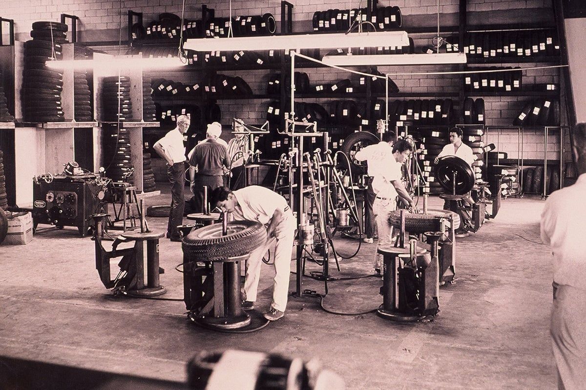 A black and white photo of people working in a factory | Lex Brodies