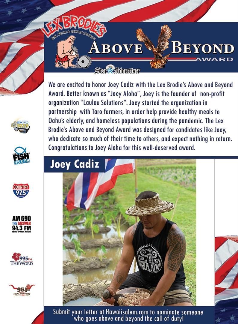 A man in a hat is sitting in front of an american flag. | Lex Brodies