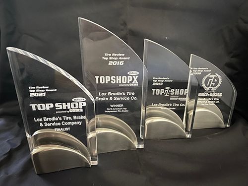 Four acrylic trophies with top shop written on them | Lex Brodies