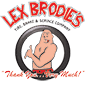A shirtless man is giving a thumbs up in a tire. | Lex Brodies