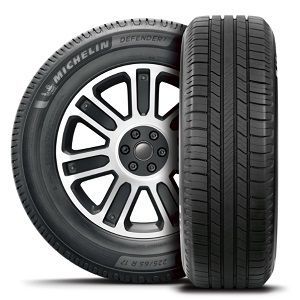 A pair of michelin defender tires on a white background. | Lex Brodies